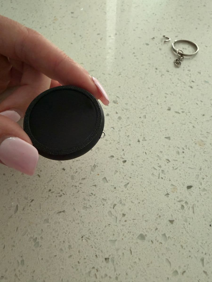 Small joiner ring threaded through the PixlTag's loop